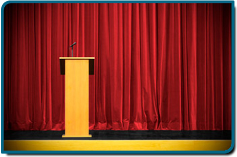 Jason Owens Public Speaker - Red Curtain & Lecturn
