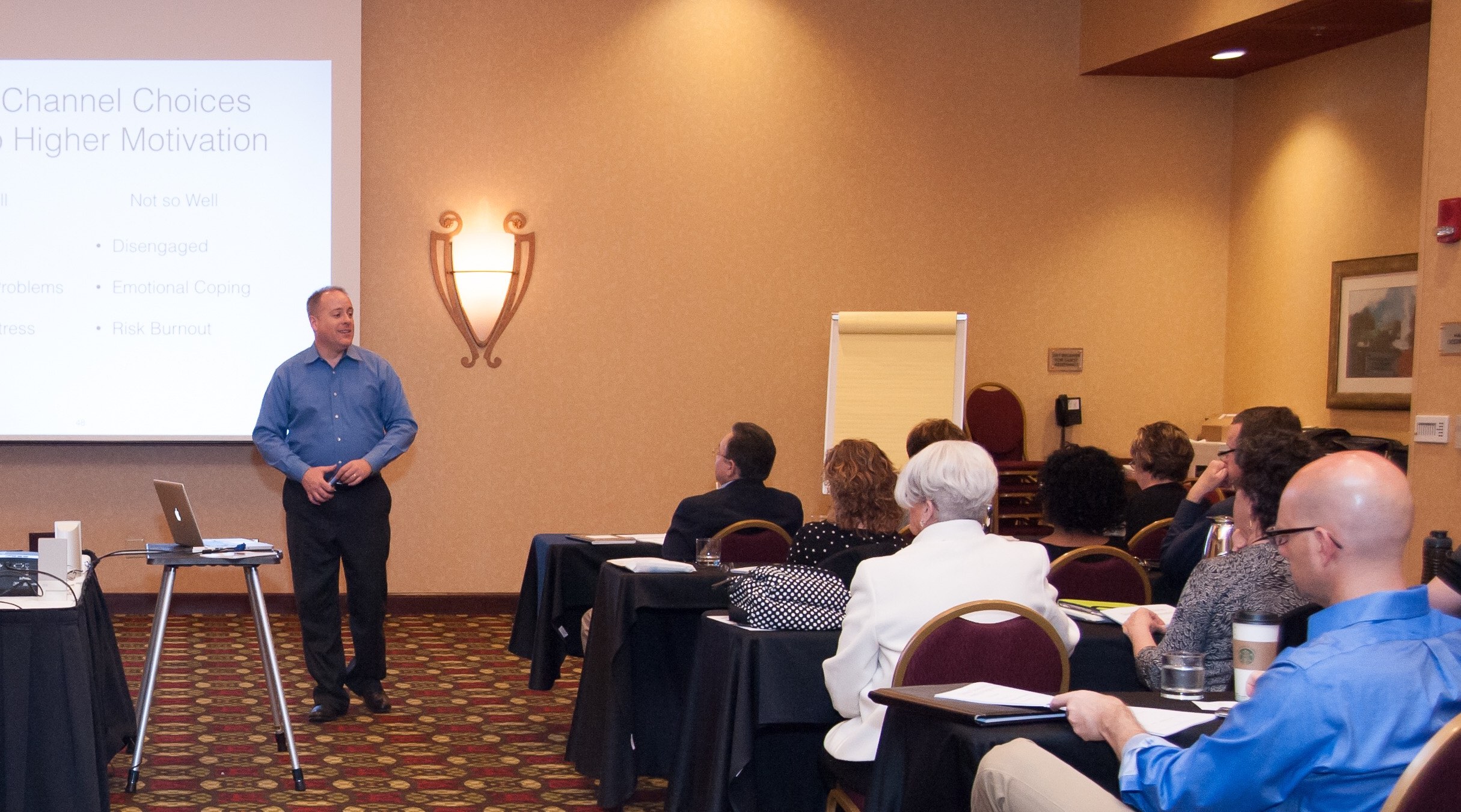 Jason R. Owens speaks to a room of entrepreneurs and small business owners.